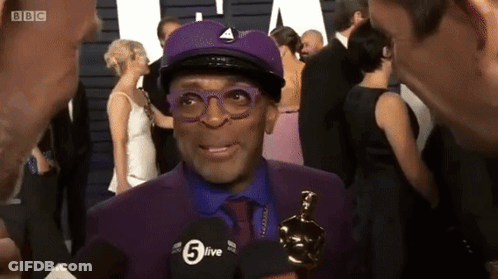 Man In Purple Suit And Hat Interviewed By BBC GIF