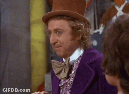 Man In Purple Suit And Top Hat Making Funny Face GIF