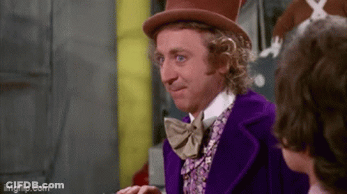 Man In Purple Suit And Top Hat Smiling Talking To Another Man GIF