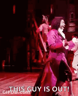 Man In Purple Suit Dancing On Stage GIF