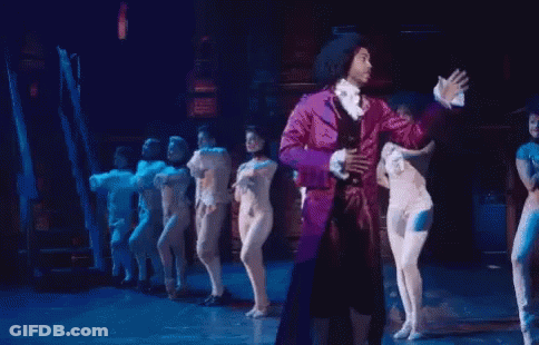 Man In Purple Suit Dancing On Stage GIF