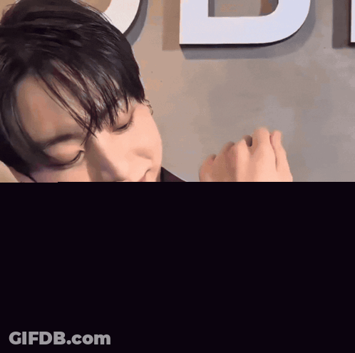 Man In Purple Suit Holding Watch GIF