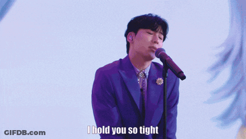 Man In Purple Suit Singing I Hold You So Tight GIF