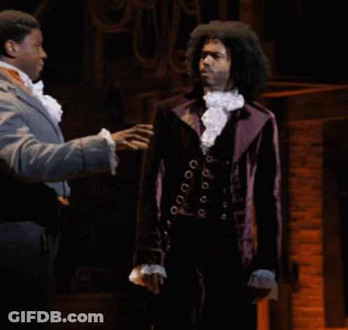 Man In Purple Suit Talking To Another Man GIF