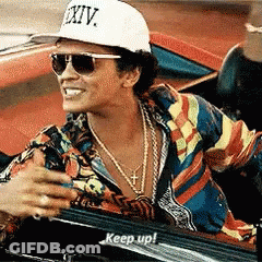 Man In Purple Suit With Disco Ball GIF