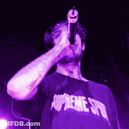 Man In Purple Supreme Shirt Singing Into Microphone GIF