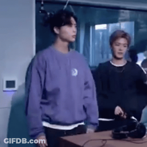 Man In Purple Sweater Next To Man In Black Shirt GIF