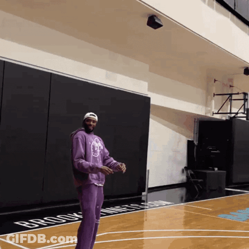 Man In Purple Sweatshirt On Brooklyn Nets Court GIF