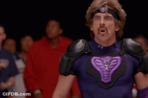 Man In Purple Throwing Ball At Lumber Liquidators GIF