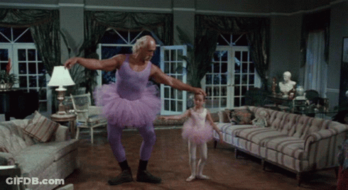 Man In Purple Tutu Holding Little Girl In Pink Tutu GIF