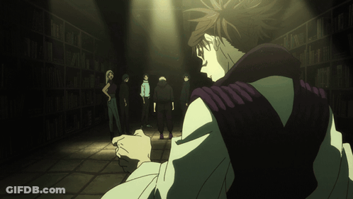 Man In Purple Vest In Dark Room With Others GIF