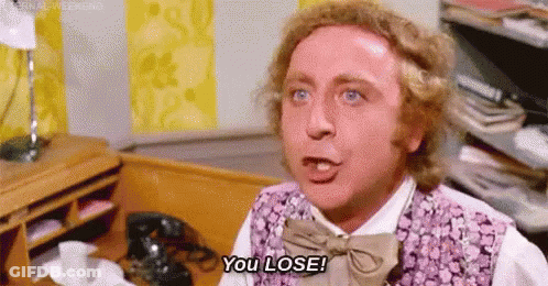Man In Purple Vest Saying You Lose At Desk GIF