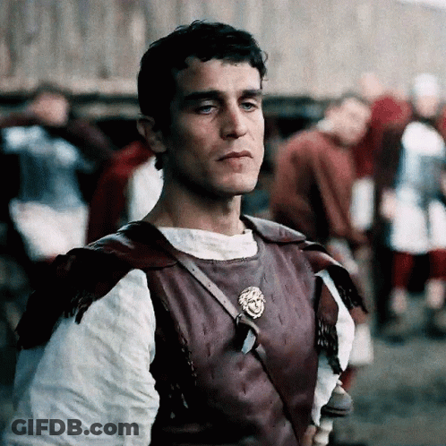 Man In Purple Vest With Lion Emblem GIF