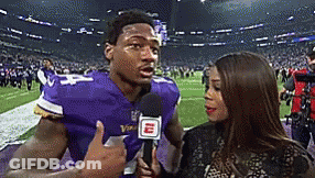 Man In Purple Vikings Jersey Interviewed By Woman GIF