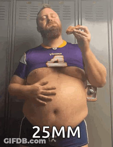 Man In Purple Vikings Shirt Eating Chicken GIF
