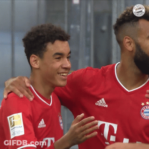 Man In Qatar Airways Jersey Hugging Another Man GIF