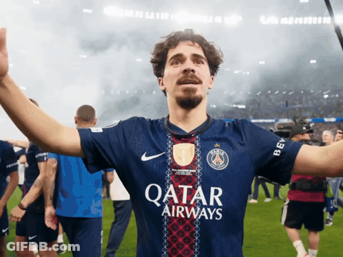Man In Qatar Airways Jersey Standing On Field GIF