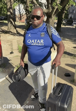 Man In Qatar Airways Shirt Carrying Suitcase GIF