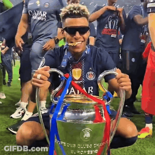 Man In Qatar Airways Shirt Holding Trophy GIF