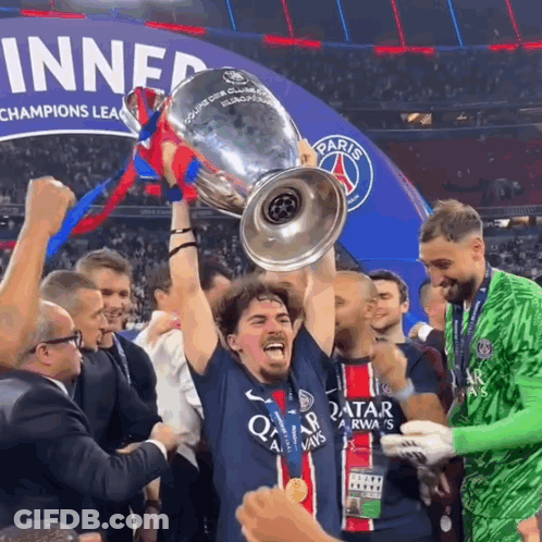 Man In Qatar Jersey Holding Trophy GIF