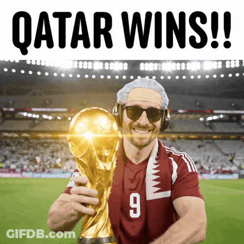 Man In Qatar Jersey Holding Trophy Says Qatar Wins GIF
