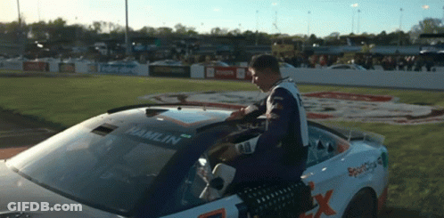 Man In Race Car With Hamlin On Windshield GIF