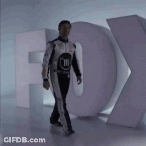 Man In Race Suit And Fox Logo GIF