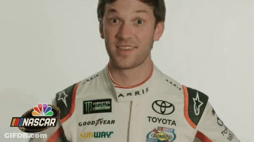 Man In Racing Suit At NBC NASCAR Logo GIF