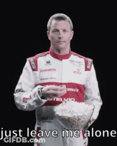 Man In Racing Suit Holding Popcorn GIF