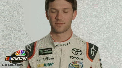 Man In Racing Suit Making Funny Face GIF