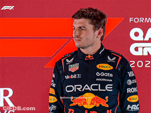 Man In Racing Suit Saying Oracle GIF