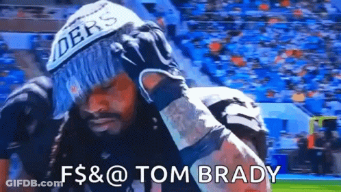 Man In Raiders Hat And Gloves Standing On Field GIF