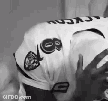 Man In Raiders Jersey Holding Football GIF