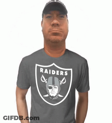 Man In Raiders T-Shirt With Helmet And Sword GIF