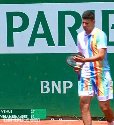 Man In Rainbow Outfit Holding Tennis Racquet BNP Sign GIF