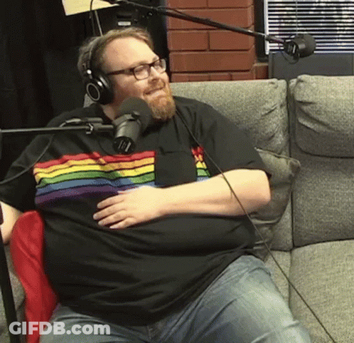 Man In Rainbow Shirt With Headphones At Microphone GIF