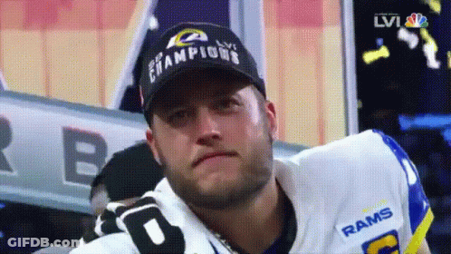 Man In Rams Jersey And Champions Hat GIF