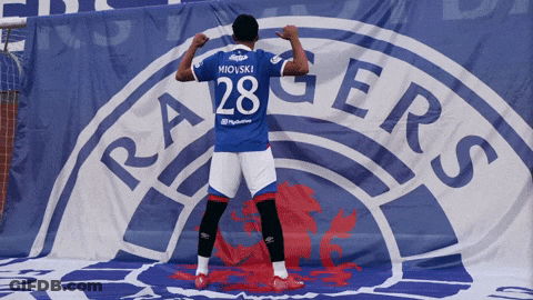 Man In Rangers Jersey In Front Of Banner GIF