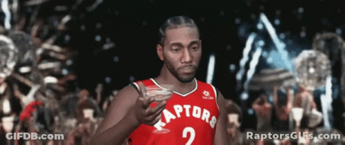 Man In Raptors Jersey Holding Drink GIF