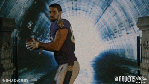 Man In Ravens Jersey Holding Football In Tunnel GIF