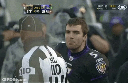 Man In Ravens Jersey Talking To Another Man GIF