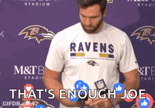 Man In Ravens Shirt In Front Of Purple Wall GIF