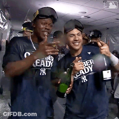 Man In Ready Shirt Holding Champagne GIF