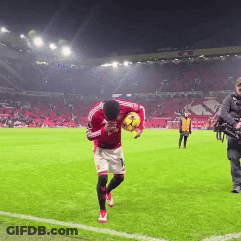 Man In Red Adidas Jersey Holding Soccer Ball GIF