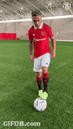 Man In Red Adidas Jersey Kicking Soccer Ball GIF