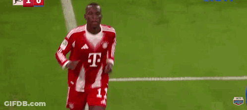 Man In Red Adidas Shirt Lifting Shirt On Soccer Field GIF