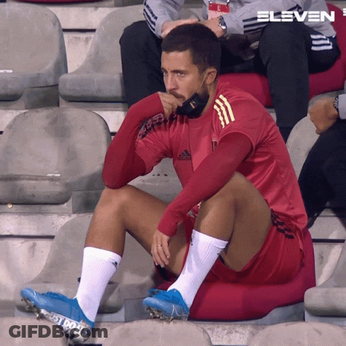 Man In Red Adidas Shirt Sitting GIF