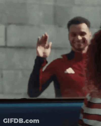 Man In Red Adidas Shirt Waving GIF