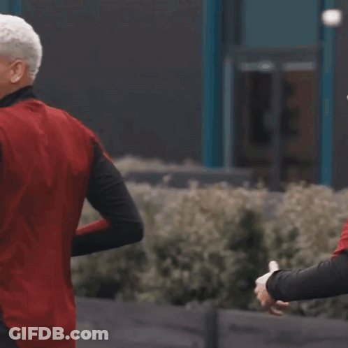 Man In Red And Black Adidas Jacket Running GIF