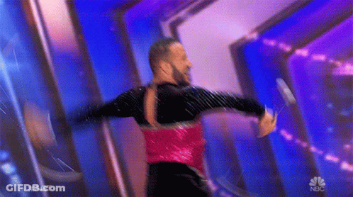 Man In Red And Black Dancing With NBC Logo GIF